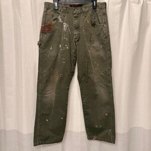 Distressed dark green wrangler Riggs cargo pants